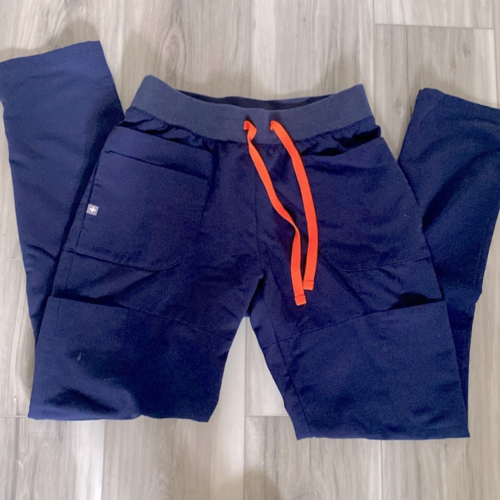 FIGS Yola Skinny in navy blue with neon orange drawstring